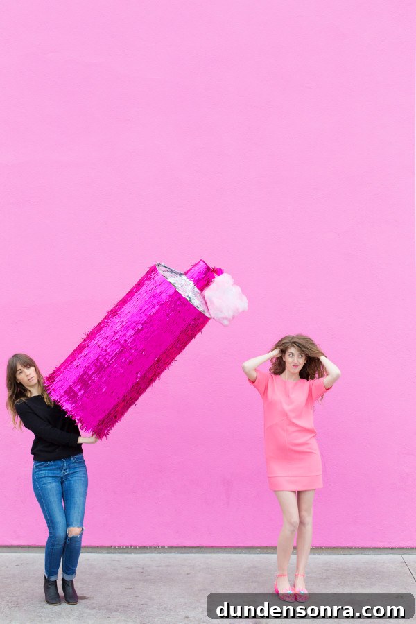 Two women and a spray bottle pinata