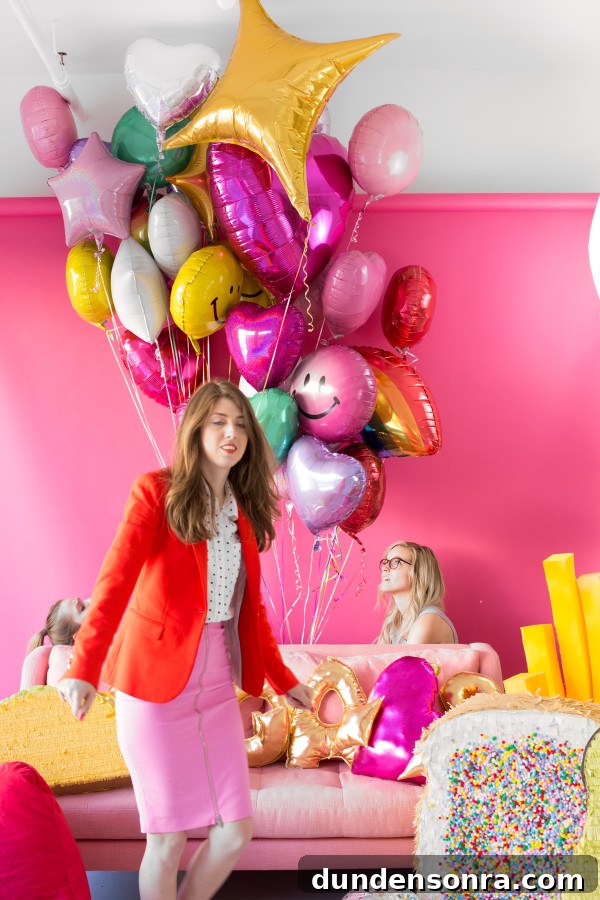A woman and a bunch of balloons