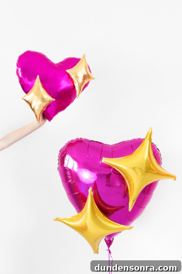 A pink balloon and pillow