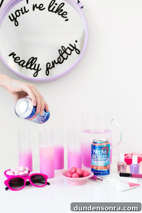 Someone pouring a drink into glasses