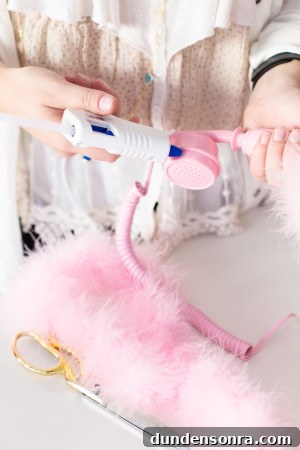 How to Make a Fuzzy Phone Case: DIY Soft Cover Tutorial 5 Someone holding a pink phone