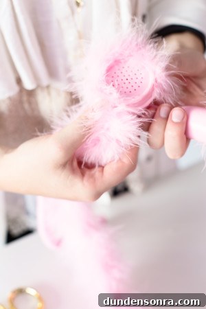 How to Make a Fuzzy Phone Case: DIY Soft Cover Tutorial 6 A woman holding a pink phone