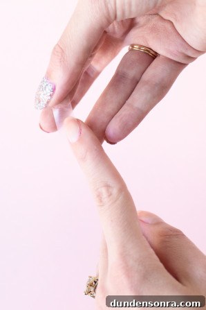 Someone painting their nail