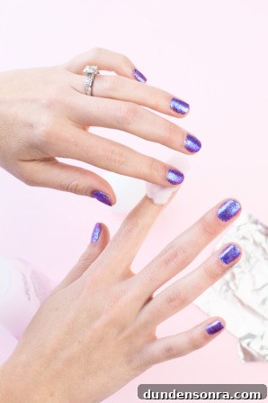 Someone with purple nails