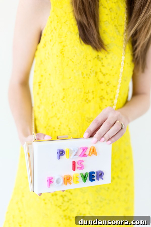 How to Make Graphic Acrylic Purses: Step-by-Step DIY Guide 2 A woman holding a plastic purse that says "pizza is forever"