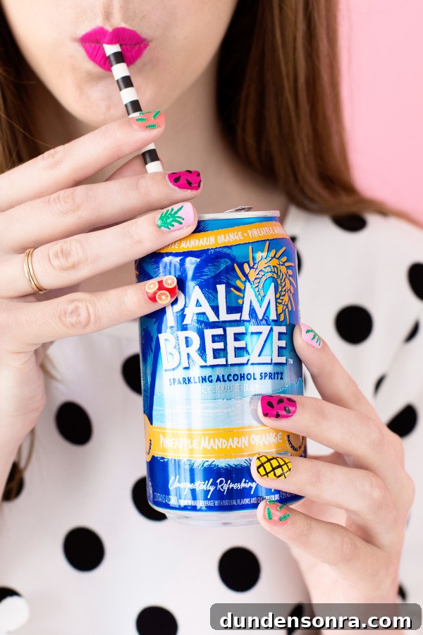 Someone holding a palm breeze drink