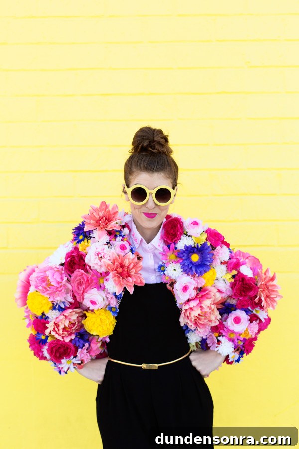 How to Make a Faux Flower Coat: Step-by-Step DIY Guide 6 A woman wearing a floral jacket in front of a yellow wall