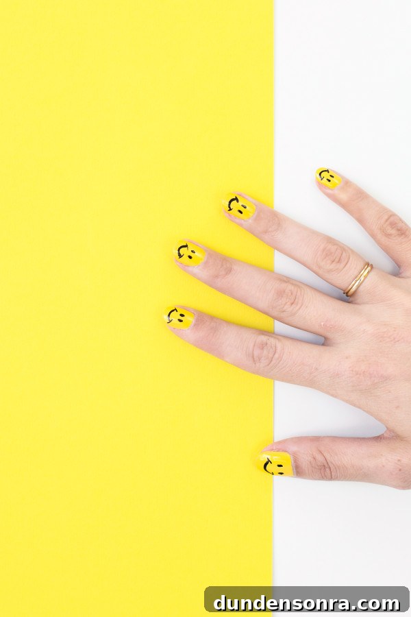 DIY Smiley Face Nail Art Ideas for Fun Manicures 2 Someone with yellow nails