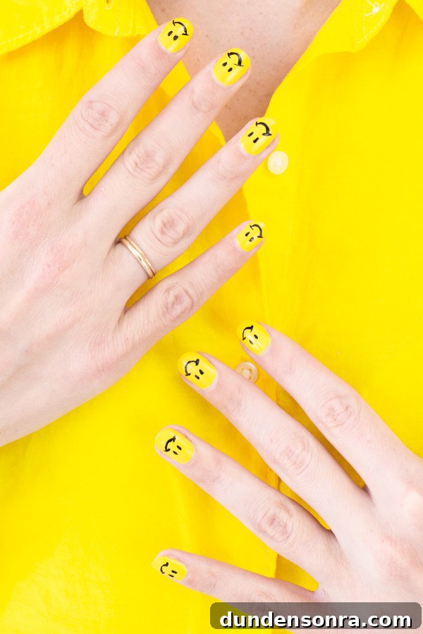 DIY Smiley Face Nail Art Ideas for Fun Manicures 3 Someone with yellow nails