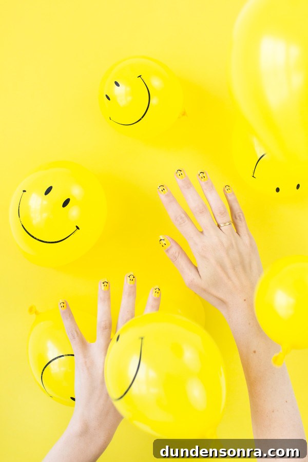 DIY Smiley Face Nail Art Ideas for Fun Manicures 4 Hands and yellow balloons