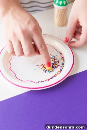 Someone holding a plate of sprinkles