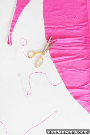 Pink fabric and scissors 