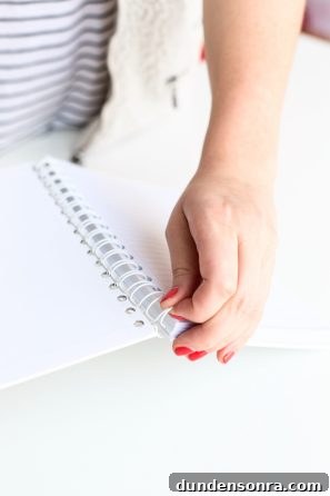 Someone holding a notebook