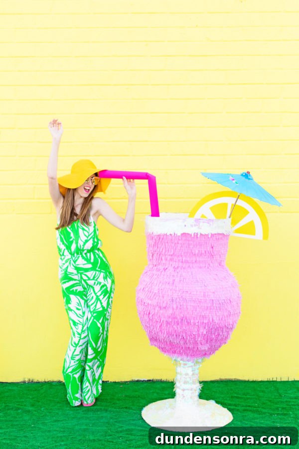 DIY Tropical Drink Piñata Tutorial: How to Make a Pineapple Party Piñata 3 A woman and a pinata