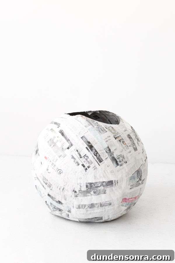 DIY Tropical Drink Piñata Tutorial: How to Make a Pineapple Party Piñata 5 A newspaper ball