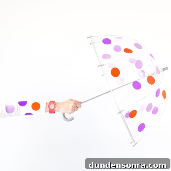 Someone holding a polka dot umbrella