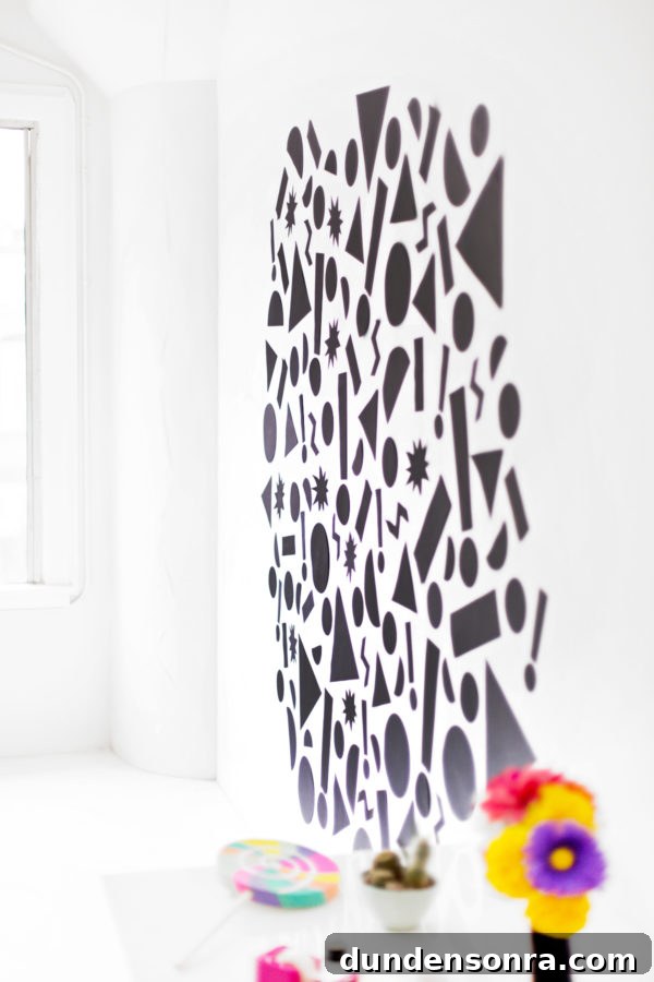Black shapes on a white wall