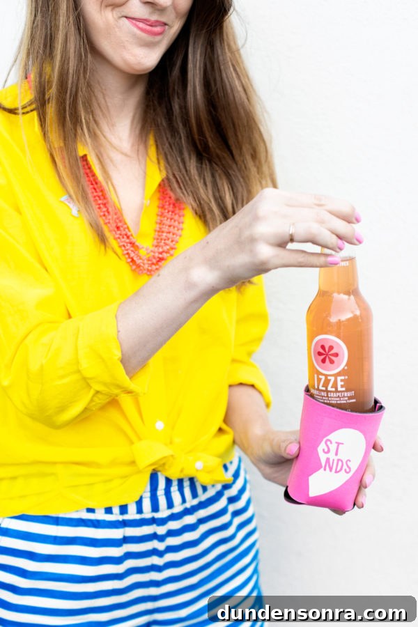Someone holding an izze drink