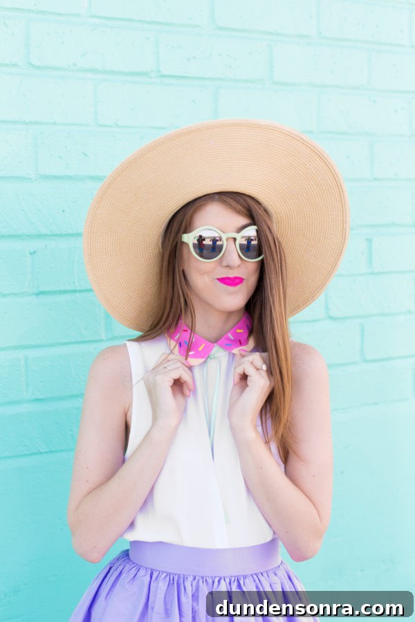 A woman wearing sunglasses and a hat posing for the camera