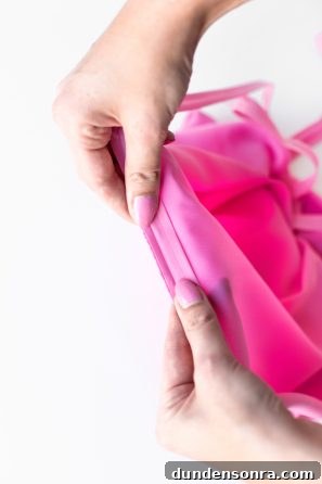 Someone holding pink fabric