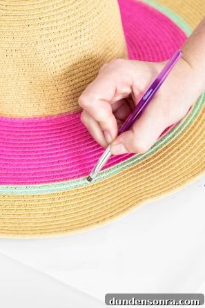 DIY Watermelon Hat: Cute Summer Floppy Sun Hat Tutorial 7 Someone painting a hat