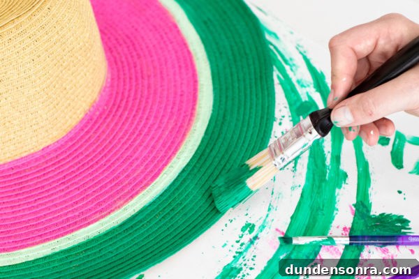 DIY Watermelon Hat: Cute Summer Floppy Sun Hat Tutorial 8 Someone painting a hat
