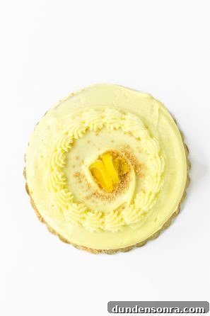 A cake with yellow frosting