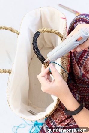 Make a Sparkling Sequin Beach Bag: DIY Step-by-Step Tutorial 11 Someone gluing something to a bag