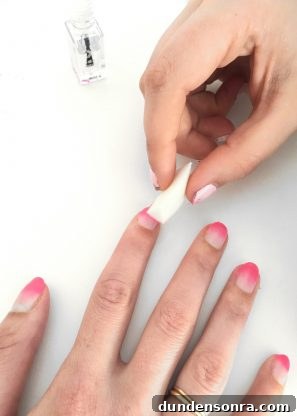 DIY Blendo Manicure Guide: How to Create Blended Nail Art at Home 3 Someone painting their nails