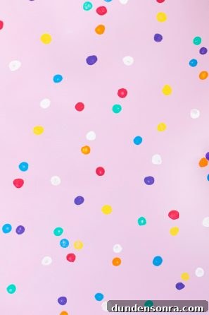 Pink background with colorful dots