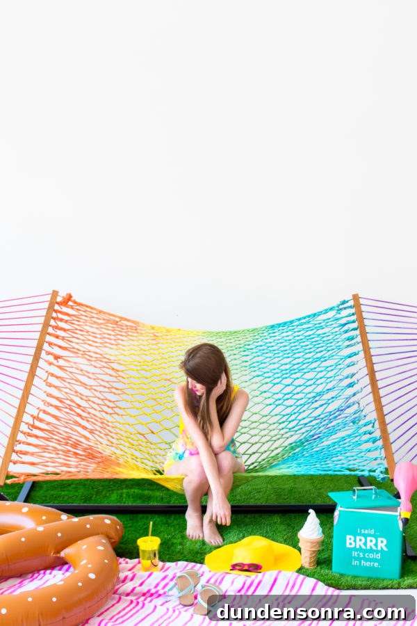Someone sitting on a rainbow hammock