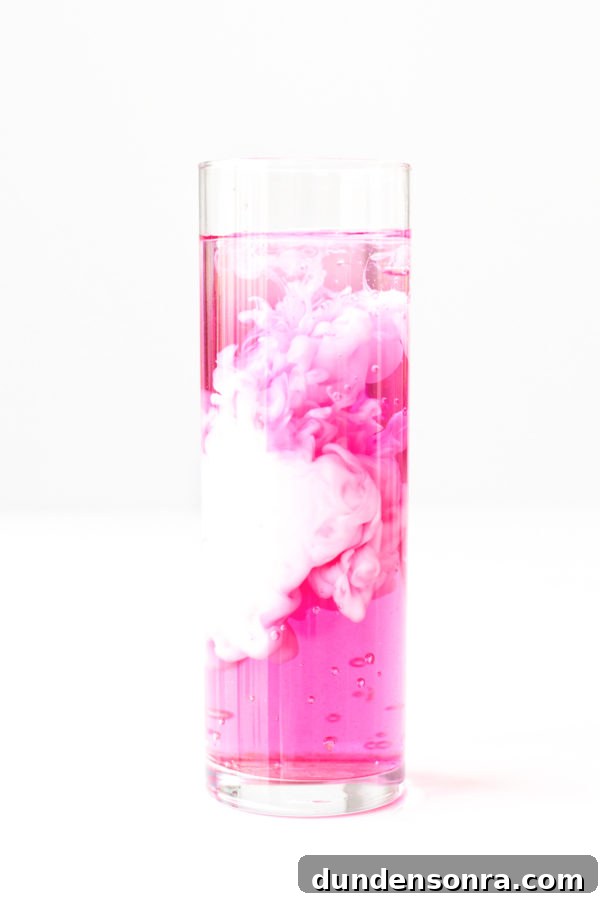 Neon Italian Cream Soda Recipes for Vibrant, Creamy Drinks 4 Pink and white liquid in a glass