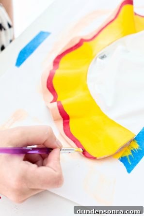 Someone painting fabric