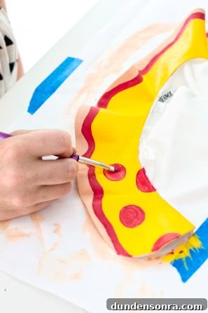 How to Make a Pizza Collarette at Home: Step-by-Step Guide 9 Someone painting pizza on a collar