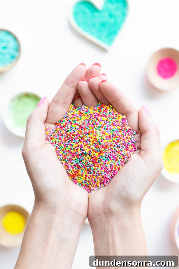 Someone holding sprinkles in their hands