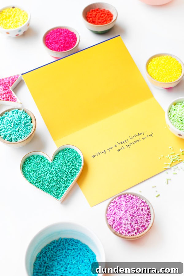 A yellow card and containers of sprinkles 