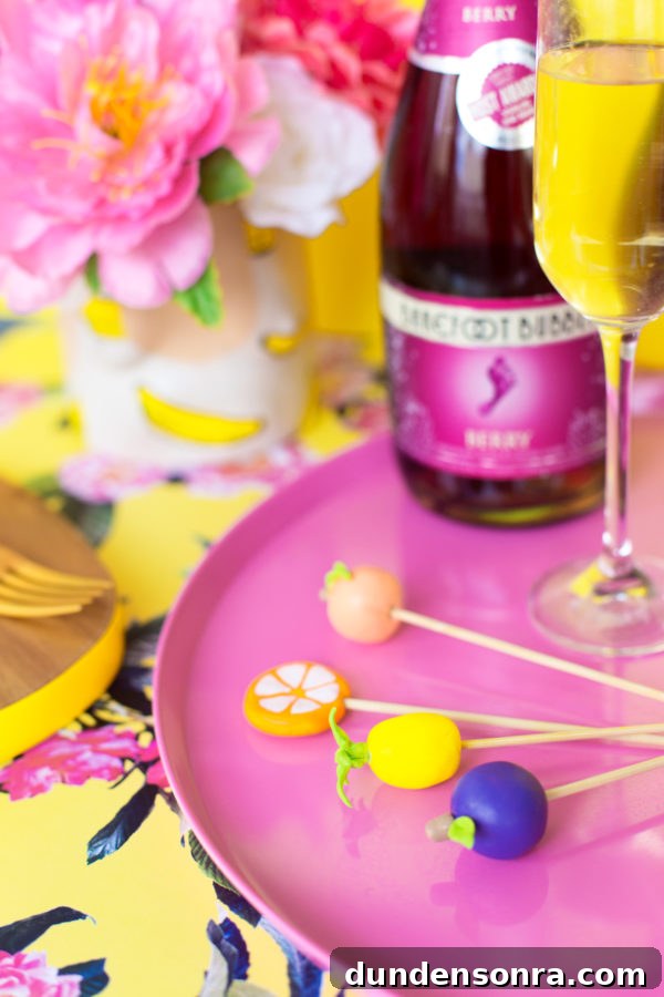 Fruit stirrers on a pink plate