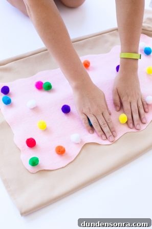 Homemade Toaster Pastry Costume: Step-by-Step DIY Guide 8 Someone putting pink fabric on beige fabric