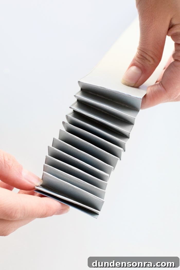 Someone holding a folded paper