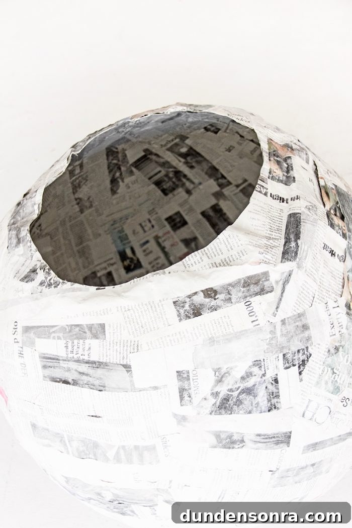 A ball with newspapers glued on it