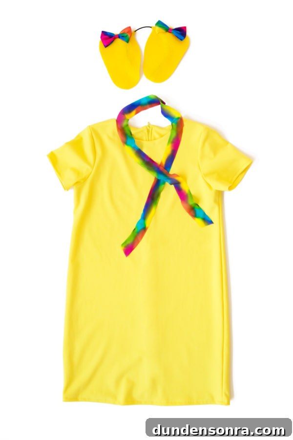 A yellow dress and rainbow scarf