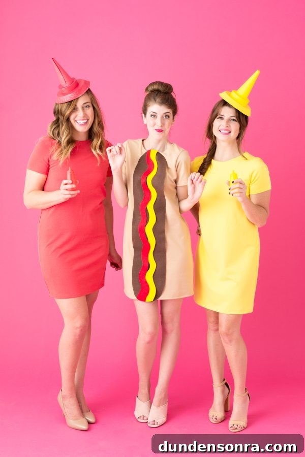 Hot Dog Trio Costumes Three people dressed as a hot dog, ketchup, and mustard.