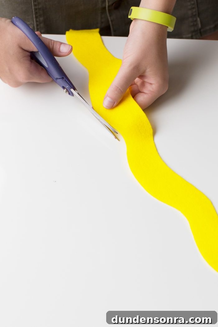 Hot Dog Costume Someone cutting yellow fabric with scissors