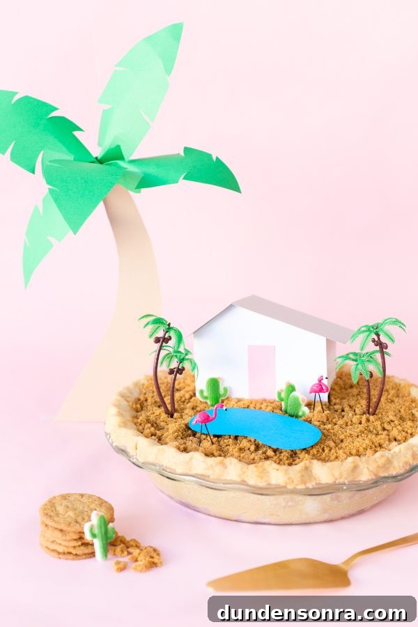 A pie with a mini house and trees on it