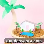 A pie with a mini house and trees on it