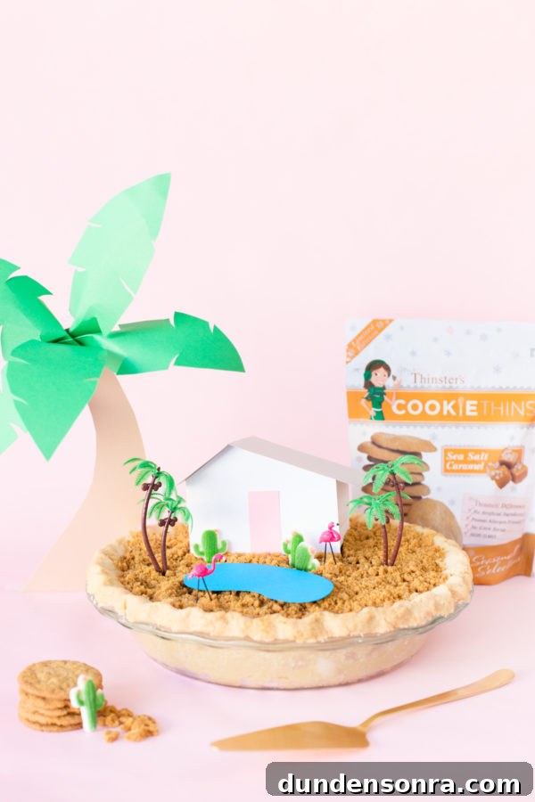 A pie with a fake house and trees on it