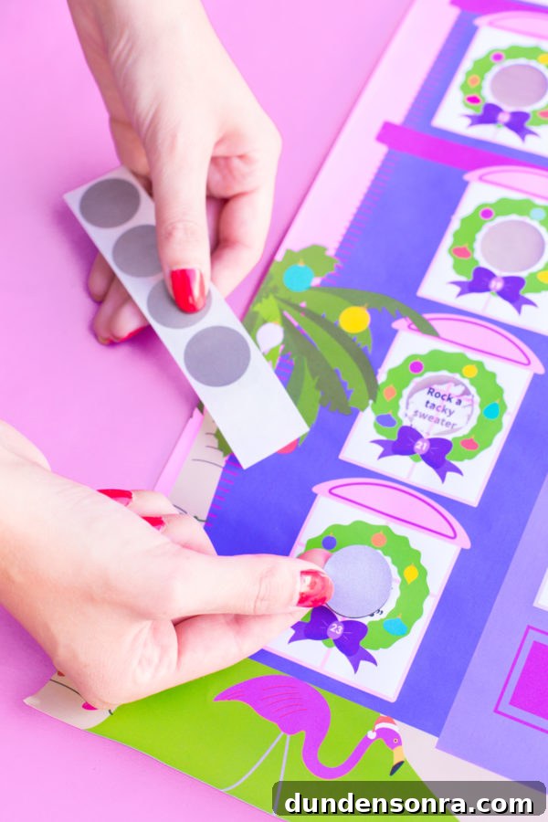 A purple and pink paper and grey circular stickers 