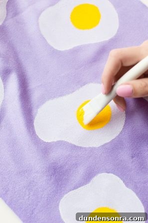 Purple fabric with egg painting on it