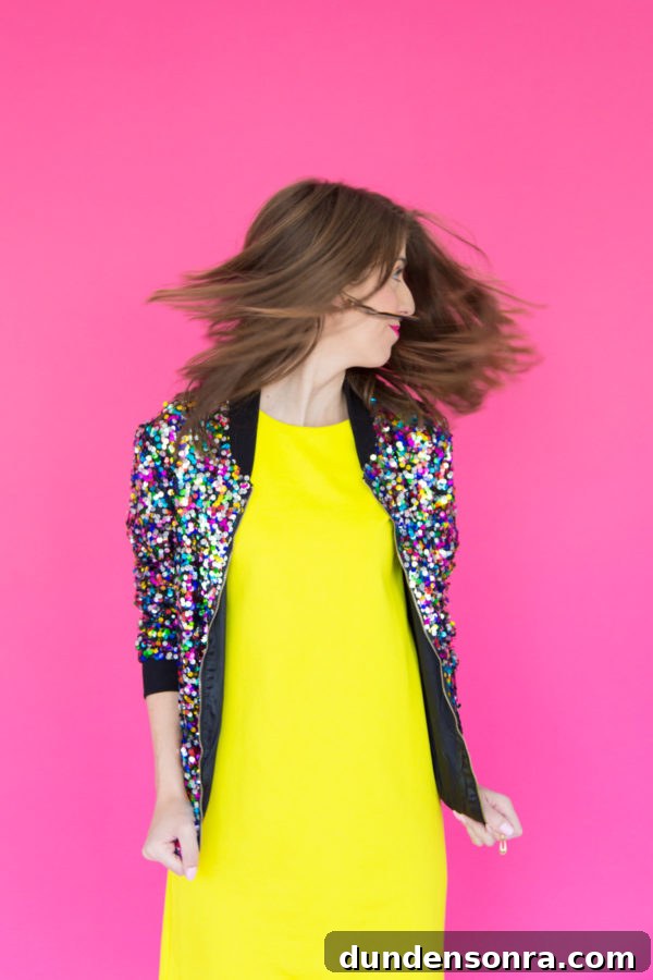 3 Colorful New Year’s Eve Outfit Ideas to Stand Out 5 A woman wearing a yellow dress and a sparkly jacket