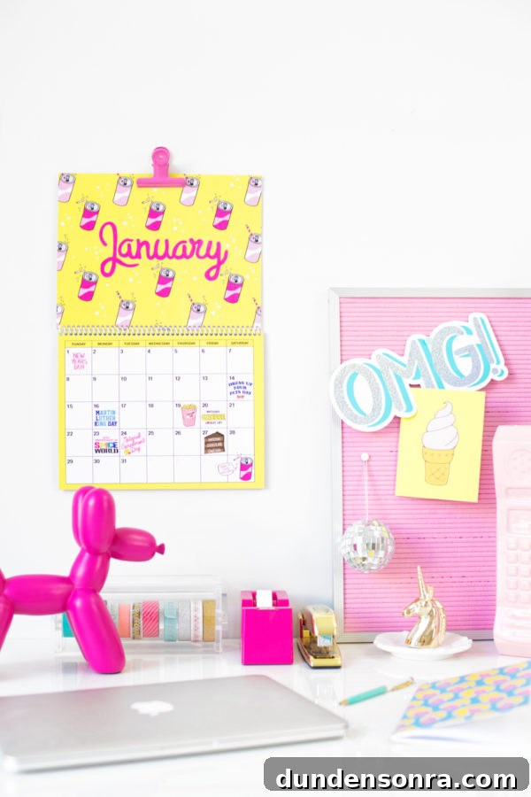 A desk with a yellow calendar and accessories